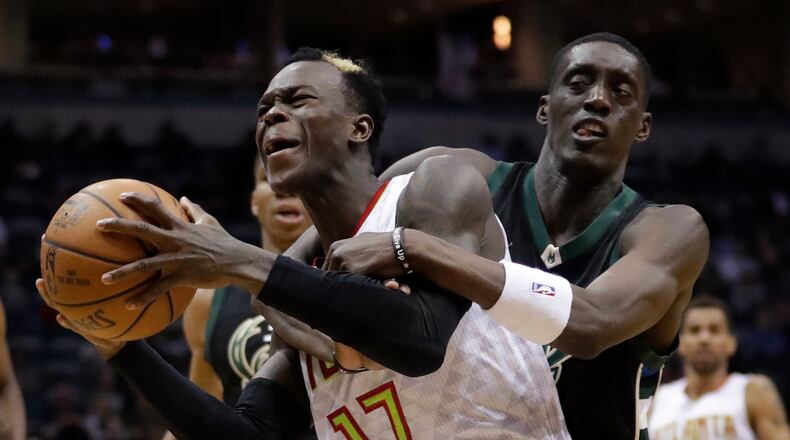 Atlanta Hawks’ Dennis Schroder is fouled by Milwaukee Bucks’ Tony Snell during the second half of an NBA basketball game Friday, March 24, 2017, in Milwaukee. (AP Photo/Morry Gash)