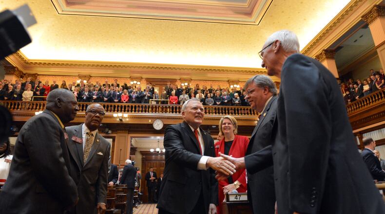 January 14, 2014 Atlanta: Gov. Nathan Deal is welcomed to the House floor before delivering the State of the State speech Wednesday January 15, 2014. BRANT SANDERLIN /BSANDERLIN@AJC.COM