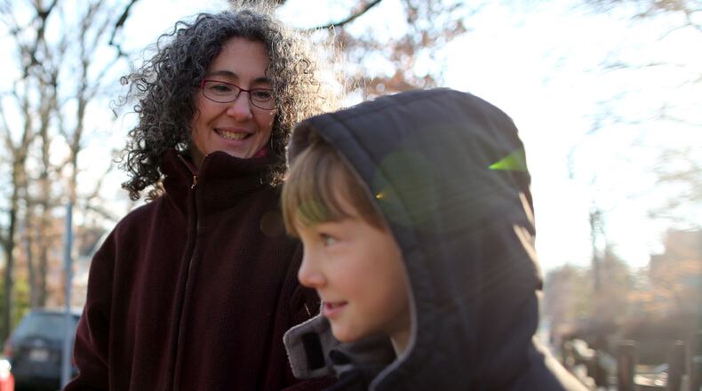 SILVER SPRING, MARYLANDSILVER SPRING, MD - JANUARY 16: Danielle Meitiv waits with her son Rafi, Meitiv, 10, for Danielle's daughter Dvora Meitiv, 6, to be dropped off at the neighborhood school bus stop in Silver Spring MD, Friday January 16, 2015. Danielle and Alexander Meitiv are being investigated by Child Protective Services for letting their children walk home alone from a playground. (Photo by Sammy Dallal/For The Washington Post via Getty Images)