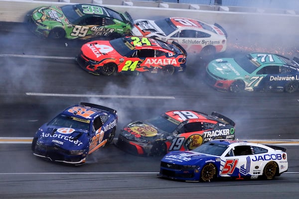 Driver Joey Logano (22) along with over twenty other drivers get tangled up in a wreck in turn three of lap sixty nine during a NASCAR Cup Series auto race, Saturday, June 28, 2025, in Hampton, Ga. (AP Photo/Russell Norris)