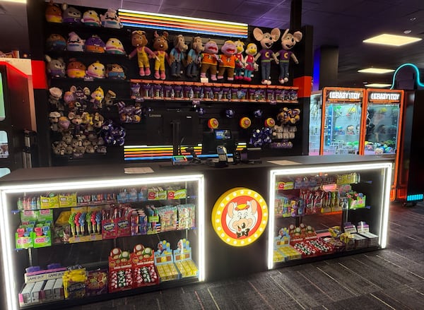 The front desk at Chuck's Arcade features the retro Chuck E. Cheese logo. (Danielle Charbonneau/AJC)