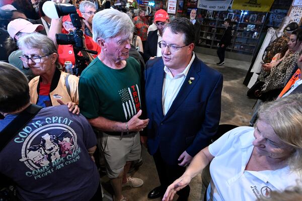 Republican candidate Randy Fine, second from right, meets with supporters after the special election for U.S. House District 6 was called in his favor, Tuesday, April 1, 2025 in Ormond Beach, Fla. (AP Photo/Phelan M. Ebenhack)