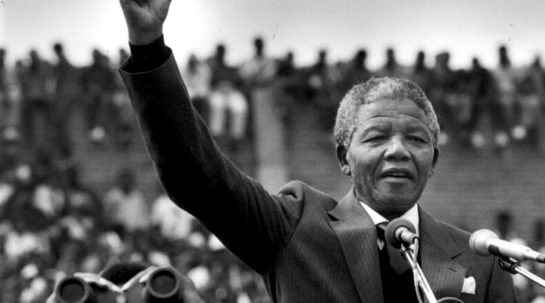 Nelson Mandela in Soweto two days after his release from prison in Cape Town. He addressed more than 100,000 people inside a soccer stadium saying, "during the past 27 years I have looked forward to this day when I would come back to the area I regard as home, to meet my brothers and sisters and grandchildren." Photo by Joanne Rathe/The Boston Globe via Getty Images