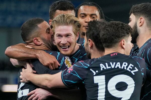 FILE - Manchester City's Kevin De Bruyne celebrates with teammates after scoring his side's opening goal during the English Premier League soccer match between Brighton and Manchester City at the Falmer Stadium in Brighton, England, Thursday, April 25, 2024. (AP Photo/Kin Cheung, file)
