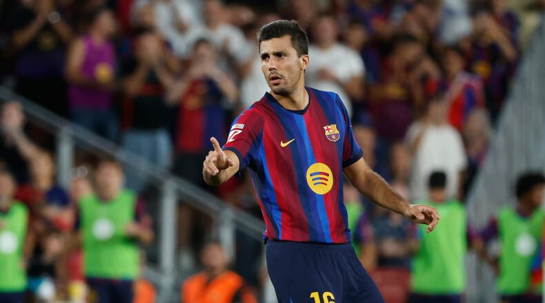 Barcelona's Rodrigo gestures during a Spanish La Liga soccer match between Barcelona and Athletic in Barcelona, Spain, Thursday, Aug. 27, 2026. (AP Photo/Joan Monfort)