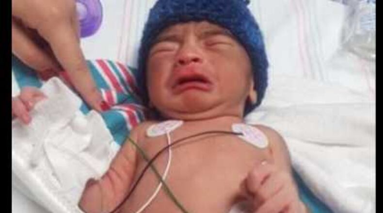 Chamblee police say this newborn boy was left outside a clinic in a gym bag.