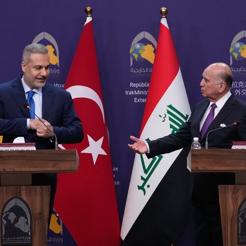 Turkish Foreign Minister Hakan Fidan, left, listens to his Iraqi counterpart Fuad Hussein during a news conference after a meeting at the foreign ministry in Baghdad, Iraq, Sunday, Nov. 2, 2025. (AP Photo/Hadi Mizban)