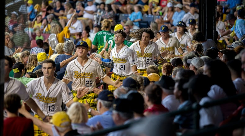 SAVANNAH, GA - JULY 12, 2022: Members of the Savannah Bananas run through the stadium during a traditional celebration of the first scored run of a home game. (AJC Photo/Stephen B. Morton)