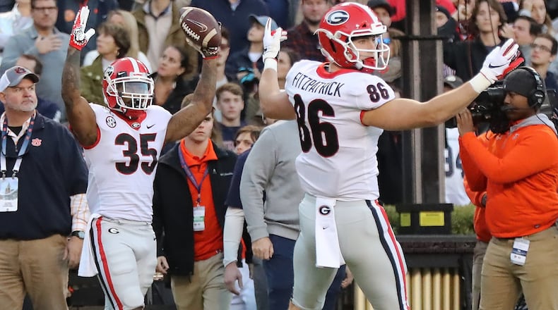 Georgia tailback Brian Herrien (left) reacts to scoring a touchdown against the Auburn Tigers as tight end John FitzPatrick looks on Saturday, November 16, 2019, in Auburn. Curtis Compton/ccompton@ajc.com