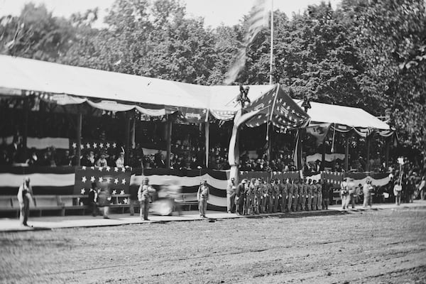The presidential reviewing stand with guests and guards with President Andrew Johnson on May 23-24, 1865, on Pennsylvania Avenue in Washington, as U.S. Army soldiers participated in the "Grand Review of the Armies. "(Library of Congress via AP)