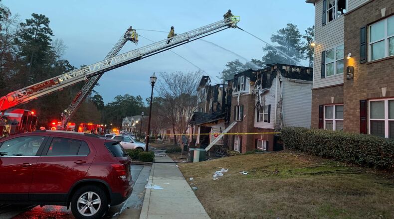 Eighteen residents, including children, were injured Friday afternoon in a fire at a DeKalb County apartment complex, authorities said.