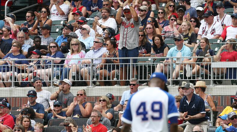 Braves fans applaud Julio Teheran as walks off the field at SunTrust Park last month.