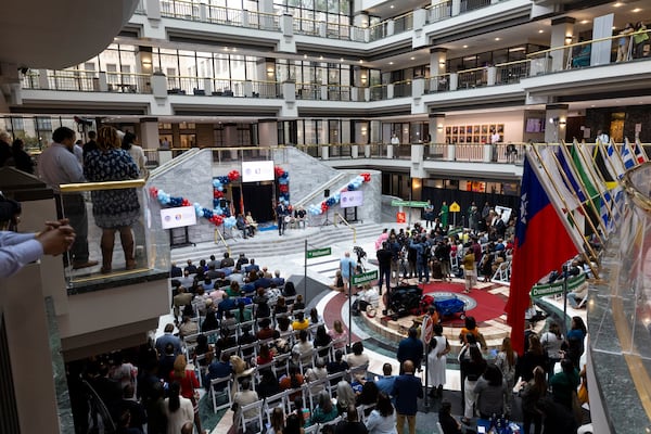 The Atlanta City Hall atrium was lined with names of neighborhoods at the center of Mayor Andre Dickens' Neighborhood Reinvestment Initiative. (Jason Getz/AJC)
