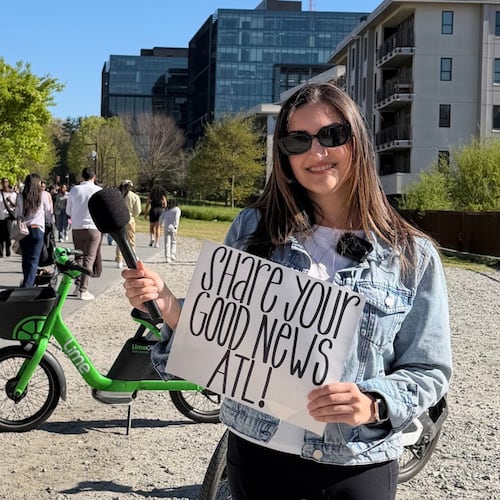Atlanta native Catherine Catoura invites pedestrians along the Beltline to share their goods news. (Courtesy of Catherine Catoura)