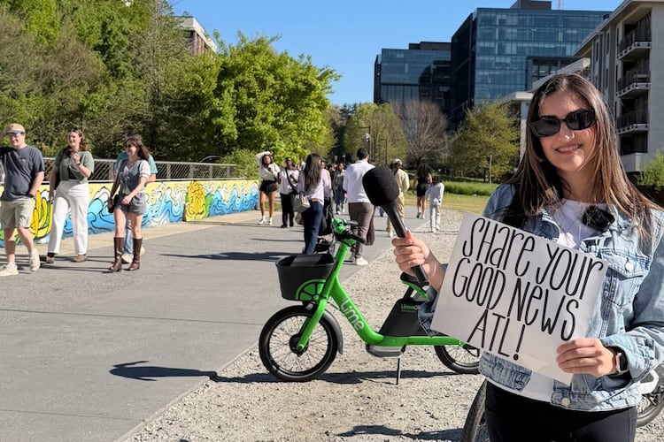 Atlanta native Catherine Catoura invites pedestrians along the Beltline to share their goods news. (Courtesy of Catherine Catoura)