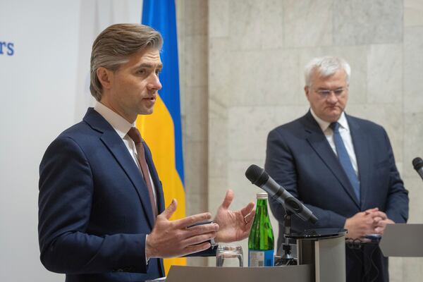 Lithuania's Foreign Minister Kestutis Budrys, left, speaks during joint press conference with Ukraine's Foreign Minister Andrii Sybiha in Kyiv, Ukraine, Tuesday, April 1, 2025. (AP Photo/Efrem Lukatsky)