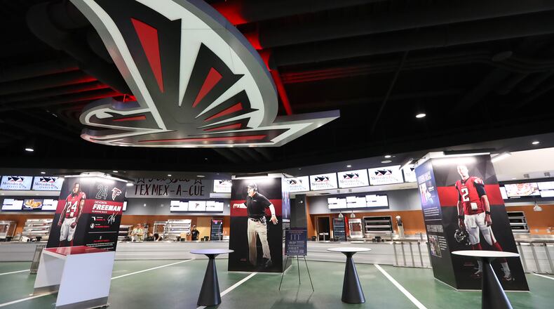 The 100 Yard Club features concession stands, bars and 11-foot-tall posters of Falcons players.