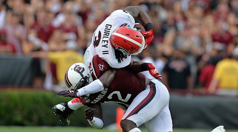 Georgia Bulldogs running back Todd Gurley is brought down by South Carolina Gamecocks safety Brison Williams second quarter at William- Brice Stadium in Columbia, S.C.