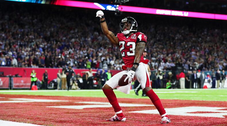 HOUSTON, TX - FEBRUARY 05: Robert Alford #23 of the Atlanta Falcons celebrates after scoring a touchdown on a 82 yard interception against the New England Patriots in the second quarter during Super Bowl 51 at NRG Stadium on February 5, 2017 in Houston, Texas. (Photo by Tom Pennington/Getty Images)