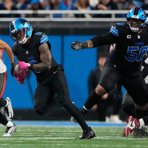 Detroit Lions running back Jammer Gibbs (0) runs for a touchdown against the Tampa Bay Buccaneers during the first half of an NFL football game, Monday, Oct. 20, 2025, in Detroit. AP Photo/Ryan Sun)