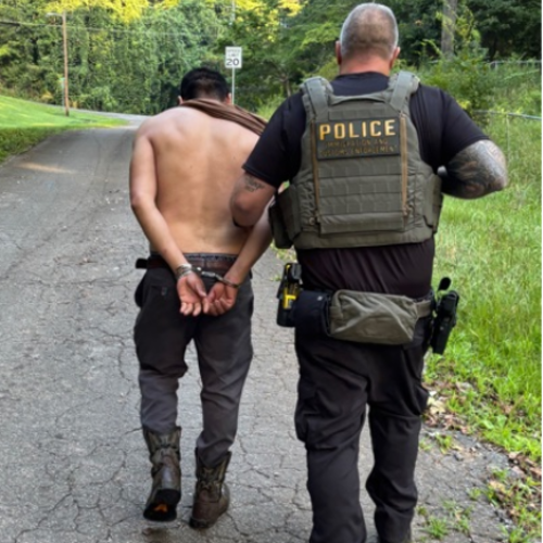 An immigration agent conducts an arrest in Georgia. (Immigration and Customs Enforcement photo)