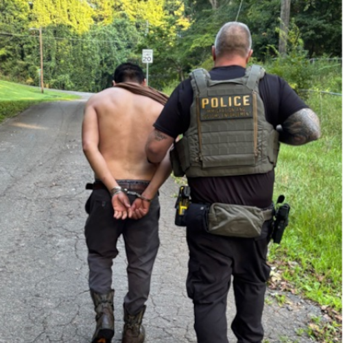 An immigration agent conducts an arrest in Georgia. (Immigration and Customs Enforcement photo)