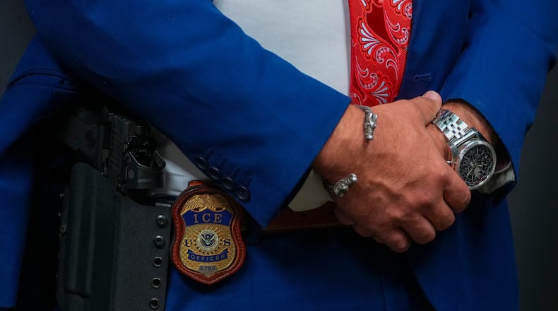 FILE - An Immigration and Customs Enforcement officer's badge is visible during an ICE hiring fair, Aug. 26, 2025, in Arlington, Texas. (AP Photo/Julio Cortez, File)
