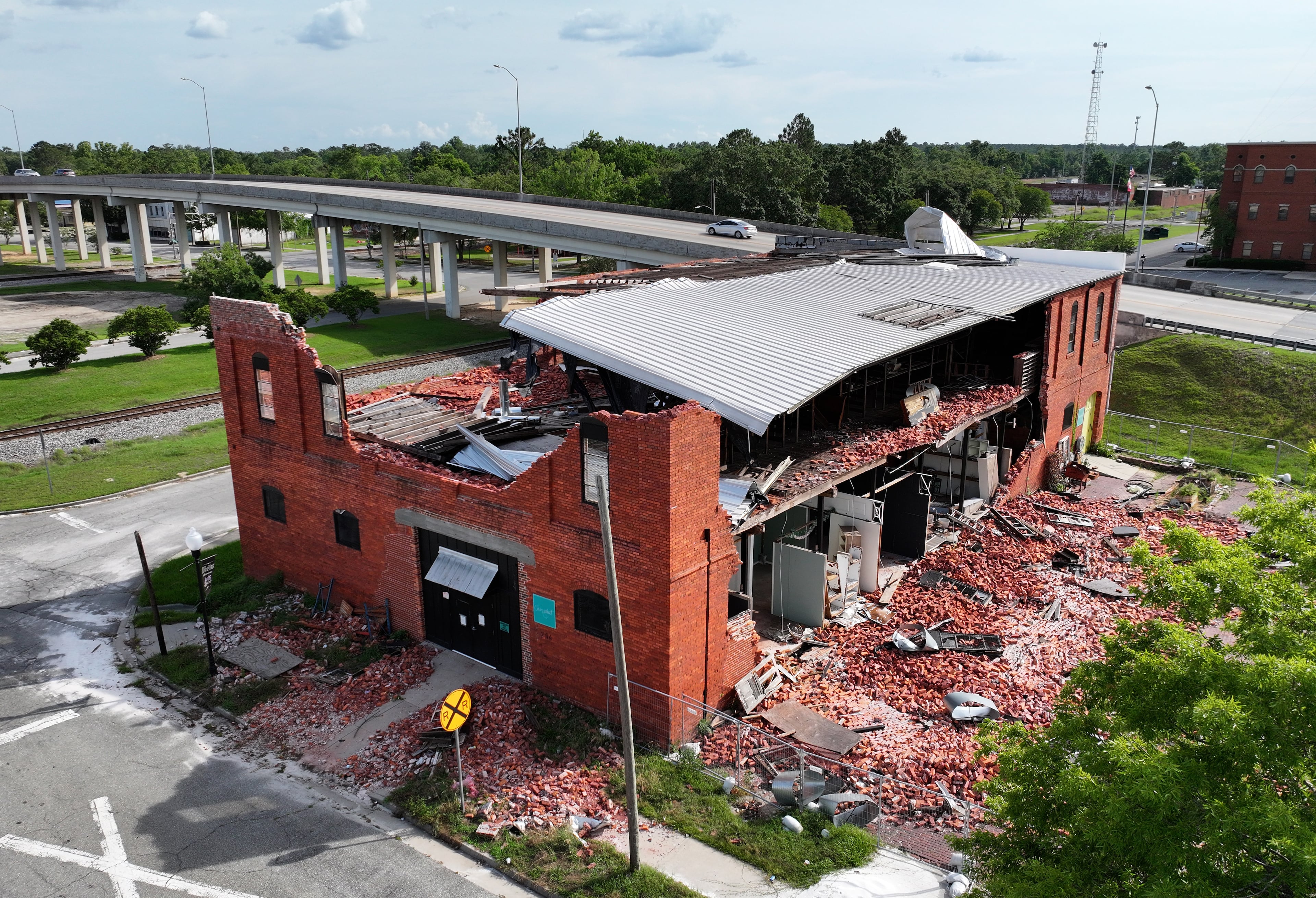 Hurricane Helene destroyed many properties across South Georgia, including Valdosta’s antique shop Chez What. Katie Wilson purchased the building in 2016, saving it from being torn down. Now she plans to demolish what is left. (Hyosub Shin/AJC)