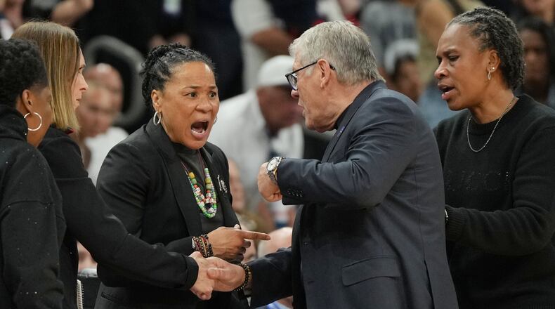 South Carolina head coach Dawn Staley, left, and UConn head coach Geno Auriemma argue after a woman's NCAA college basketball tournament semifinal game at the Final Four, Friday, April 3, 2026, in Phoenix. (AP Photo/Rick Scuteri)