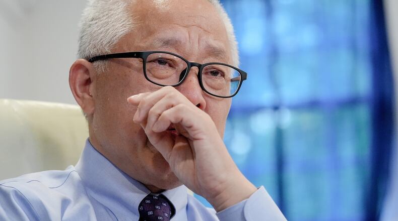 Chinese pastor Ezra Jin Mingri becomes emotional during an interview with The Associated Press in Maryland, Wednesday, July 22, 2026 . (AP Photo/Mariam Zuhaib)