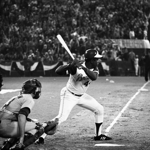 Hank Aaron at bat just before hitting his record-breaking 715th home run at Atlanta-Fulton County Stadium on April 8, 1974. (Billy Downs/AJC 1974)