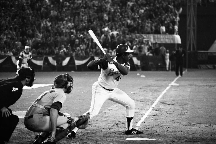 Hank Aaron at bat just before hitting his record-breaking 715th home run at Atlanta-Fulton County Stadium on April 8, 1974. (Billy Downs/AJC 1974)