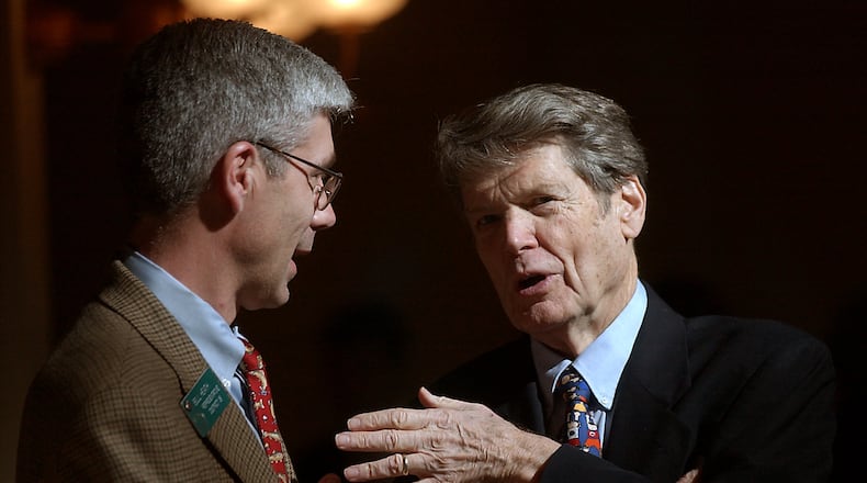 The always immaculately dressed and well-coifed Capitol lobbyist Abit Massey (right) buttonholed then-Rep. Bill Health outside of the House chamber in this 2004 photo. Massey helped grow the Georgia poultry industry into a multi-billion dollar business in Georgia. (BEN GRAY/STAFF