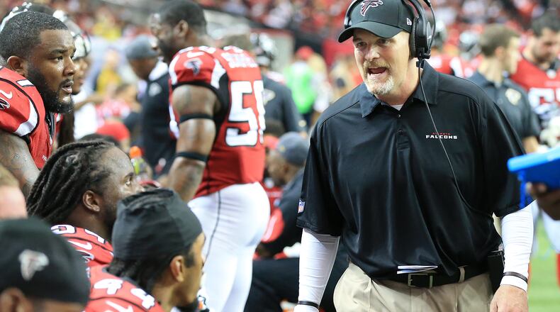 Falcons head coach Dan Quinn tries to fire up his defense after quarterback Matt Ryan was intercepted by the Vikings in the endzone during the third quarter in a football game on Sunday, Nov. 29, 2015, in Atlanta.