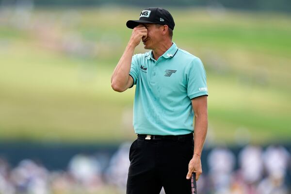 Carlos Ortiz, of Mexico, reacts after missing a putt on the fourth hole during the final round of the U.S. Open golf tournament at Oakmont Country Club Sunday, June 15, 2025, in Oakmont, Pa. (AP Photo/Charlie Riedel)