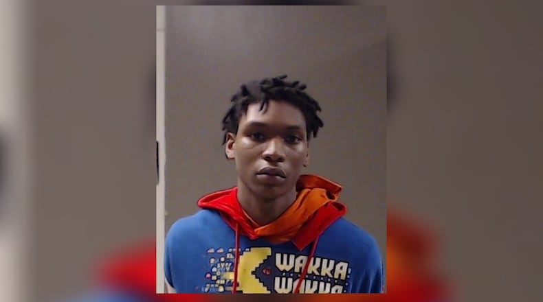 Malachi Coleman, 21, is accused of shooting two teenagers near a home in Stone Mountain.