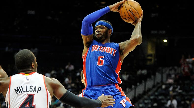 Pistons forward Josh Smith (6) goes up against Hawks forward Paul Millsap (4) during the second half of a preseason NBA basketball game, Saturday, Oct., 18, 2014, in Atlanta. Detroit won 104-100.