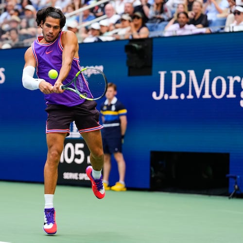 Carlos Alcaraz, of Spain, returns the ball during a mixed doubles match at the U.S. Open tennis championships, Tuesday, Aug. 25, 2026, in New York. (AP Photo/Yuki Iwamura)