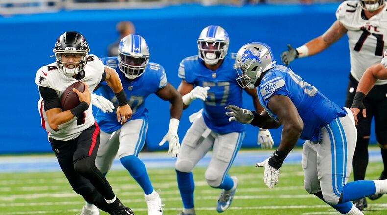 Atlanta Falcons quarterback Desmond Ridder scrambles during the first half of a preseason NFL football game against the Detroit Lions, Friday, Aug. 12, 2022, in Detroit. (AP Photo/Paul Sancya)