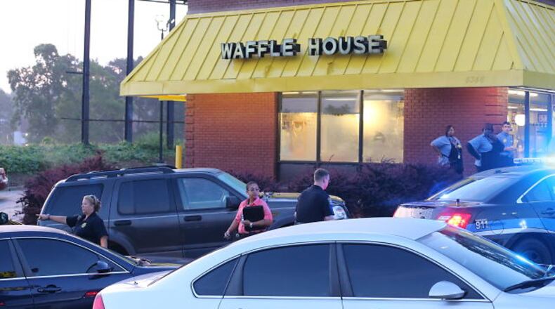 One person is dead and another in custody following a predawn shooting at a south Fulton County Waffle House. JOHN SPINK/JSPINK@AJC.COM