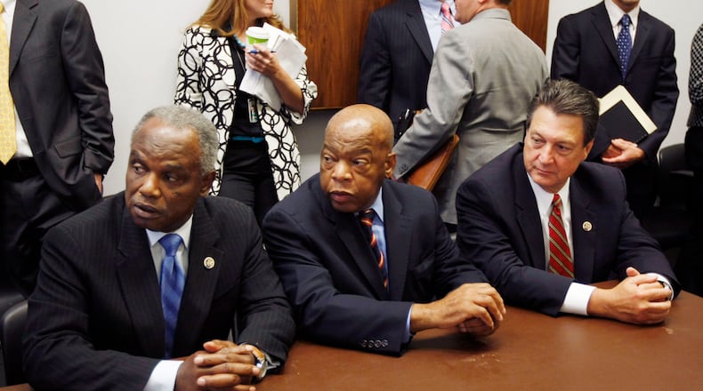 Rep. David Scott, D-Ga., left, Rep. John Lewis, D-Ga., and Rep. Lynn Westmoreland, R-Ga., take their seats as the Georgia Congressional delegation meets over Georgia's use of Lake Lanier's water on Capitol Hill in Washington, Tuesday, July 21, 2009. (AP Photo/Gerald Herbert) Rep. David Scott, D-Ga., left, Rep. John Lewis, D-Ga., center, in 2009. (AP Photo/Gerald Herbert)