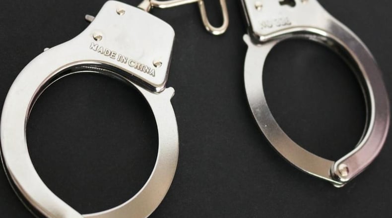 Clayton County police arrested a man and a youth in connection with the killing of a woman April 30 at a Jonesboro mobile home park.