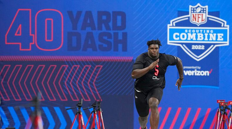 Georgia defensive lineman Jordan Davis runs the 40-yard dash during the NFL football scouting combine, Saturday, March 5, 2022, in Indianapolis. (AP Photo/Darron Cummings)