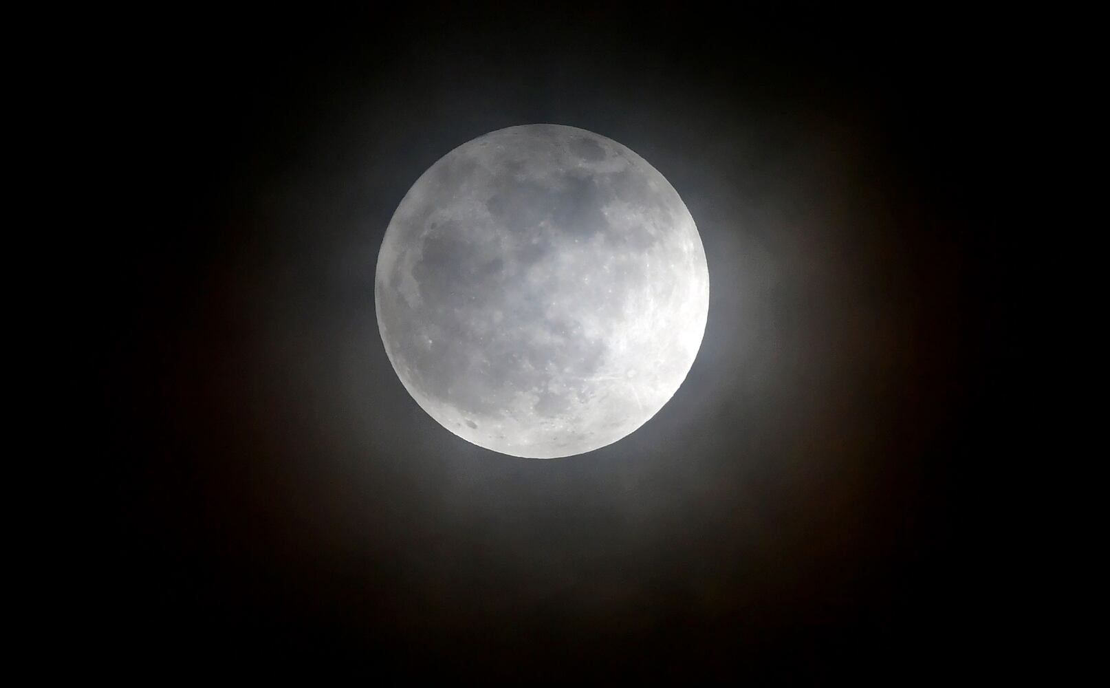 Photos: December full moon, the last of the decade, lights up the night sky