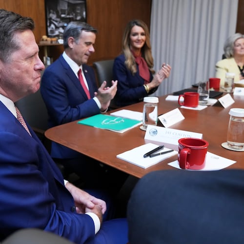 Jay Clayton, left, listens during a cabinet meeting, Friday, July 31, 2026, at Camp David, the presidential retreat, near Thurmont, Md., Friday, July 31, 2026. (AP Photo/Jacquelyn Martin)