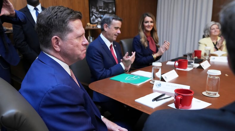Jay Clayton, left, listens during a cabinet meeting, Friday, July 31, 2026, at Camp David, the presidential retreat, near Thurmont, Md., Friday, July 31, 2026. (AP Photo/Jacquelyn Martin)