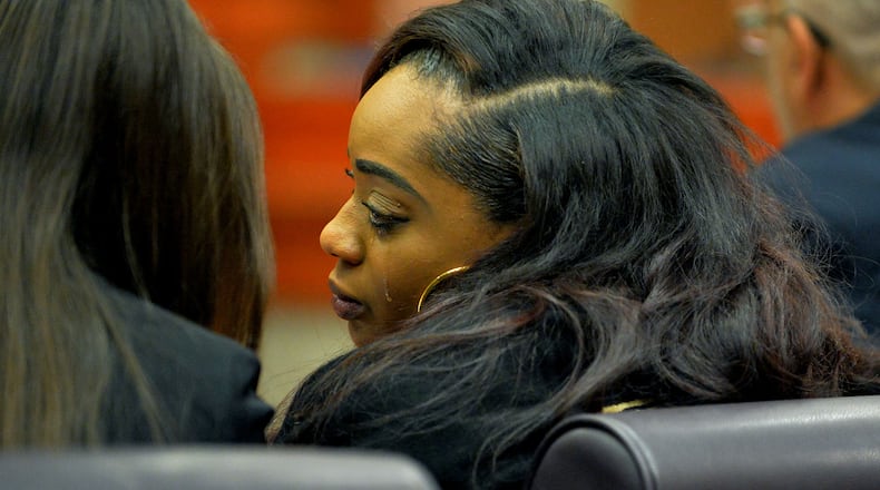 Rockell Coleman pleaded guilty to involuntary manslaughter charges in the a 2014 house fire that killed three of her sons. In this January 2015 photo, Coleman reacts to a DeKalb County Superior Court judge's ruling that she cannot see her surviving children before or during the case.