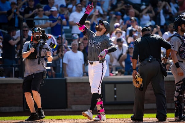 New York Mets' Brandon Nimmo celebrates his grand slam during the first inning of a baseball game against the New York Yankees, Saturday, July 5, 2025, in New York. (AP Photo/Angelina Katsanis)