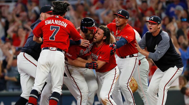 ATLANTA, GEORGIA - JUNE 14:  Brian McCann #16 of the Atlanta Braves reacts after hitting a walk-off single to score two runs to give the Braves a 9-8 win over the Philadelphia Phillies at SunTrust Park on June 14, 2019 in Atlanta, Georgia. (Photo by Kevin C. Cox/Getty Images)