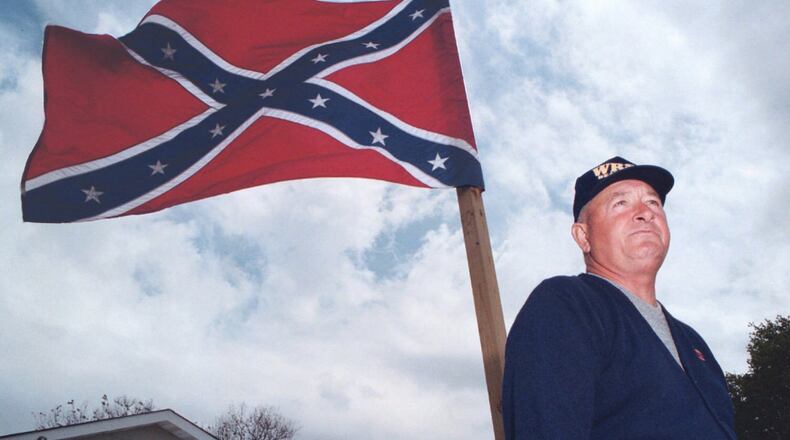 A Winthrop University poll of Southern adults finds that while 55 percent of its white respondents see the Rebel battle flag as a symbol of Southern pride, only 44 percent of those same respondents give the Confederate emblem a favorable rating. (AP Photo/The Huntsville Times, Glenn Baeske)